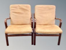 A pair of Scandinavian stained beech bentwood armchairs in tan leather width 62 cm