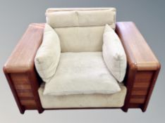 A 1960's Scandinavian teak framed oversized armchair,