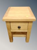 A contemporary oak lamp table fitted a drawer,