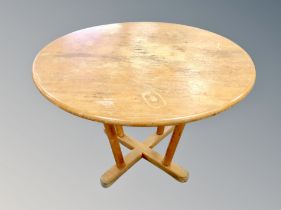 A Scandinavian circular oak occasional table,