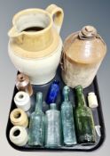 An antique stoneware bottle stamped Symonds & Symonds together with a further stoneware jug,
