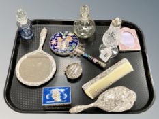A collection of dressing table items, cloisonne mirror, glass bottles, brush and comb,