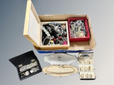 A box containing an assortment of costume jewellery, earrings,