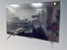 A Samsung 43 inch LCD TV with lead and remote
