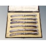 A cased set of six silver handled butter knives