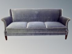 An early 20th century three seater settee in blue dralon,