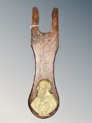 A Victorian oak boot pull with applied brass plaque