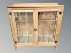 Mouseman : A Robert Thompson English oak leaded glazed door cabinet,