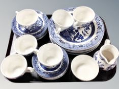 Twenty six pieces of Churchill blue and white willow pattern tea china