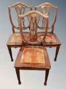 A set of reproduction shield backed dining chairs