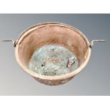 A 19th century copper swing handled cooking pot,