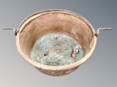 A 19th century copper swing handled cooking pot,