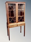 A reproduction mahogany display cabinet on stand width 82 cm