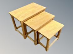 Mouseman : A Robert Thompson English oak nest of adzed graduated tables, the largest width 61 cm,