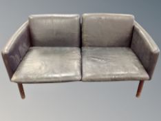 A 20th century Danish three piece lounge suite comprising of two seater settee and pair of