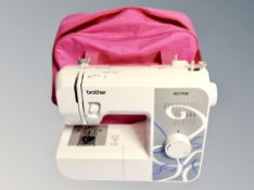 A Brother AE1700 electric sewing machine in carry case together with a Rolec wallpod socket