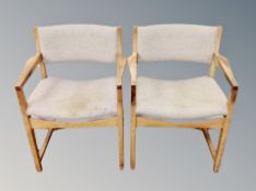 A pair of Danish blond oak armchairs in oatmeal fabric