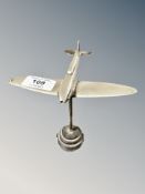 A die cast metal figure of a spitfire,