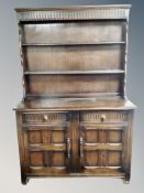 A stained oak dresser,