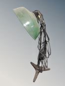 A mid century adjustable angle poise lamp with green enamelled shade
