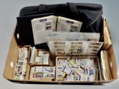 A holdall and a large quantity of vintage cigarette cards,