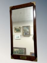 A mahogany framed mirror with brass re-enforced corners,