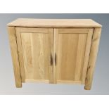 A contemporary oak double door cabinet