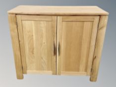 A contemporary oak double door cabinet