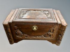 A Chinese carved camphor wood blanket chest