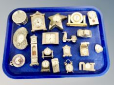 A tray of quantity of miniature silver finished novelty desk clocks