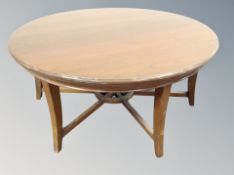 A contemporary circular ship's wheel style coffee table