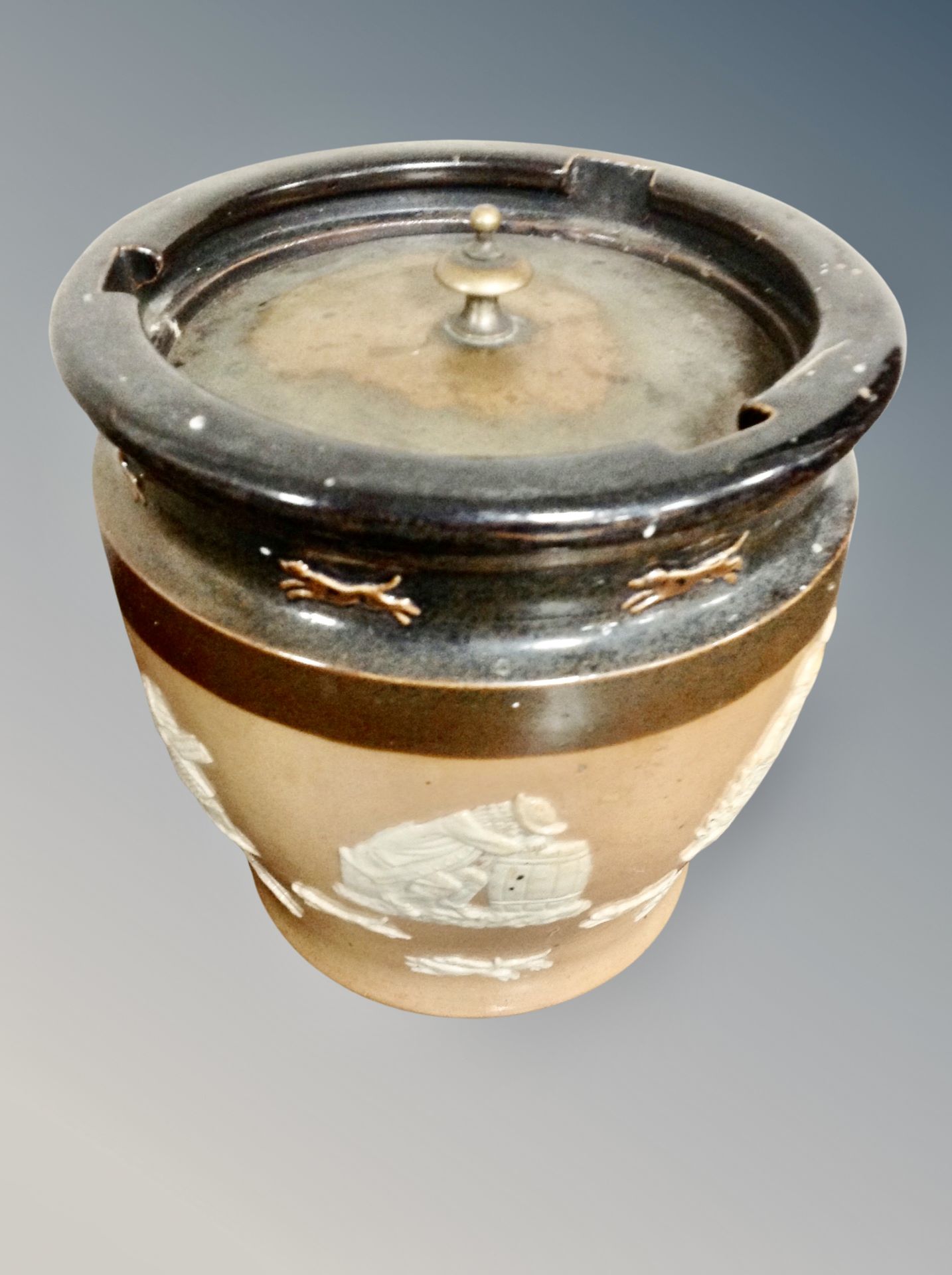 A 19th century glazed pottery tobacco jar with lid