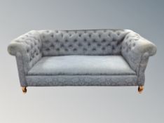 A 19th century drop end Chesterfield settee in blue floral fabric