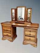 A Willis and Gambier twin pedestal knee hole dressing table with triple mirror