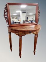 A sheesham wood demi lune hall table together with similar mirror