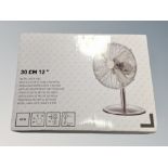 A 30 cm metal desk fan new in box