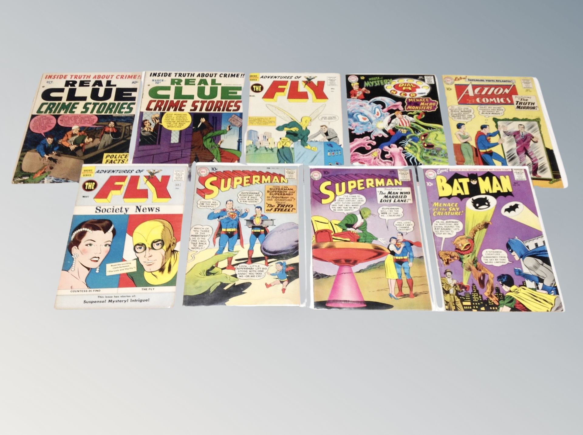 Nine 20th century comics to include DC Batman #135 10¢, Superman #135 and 136 10¢,