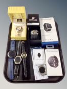 A tray of collection of assorted smart watches, an Accurst watch box,