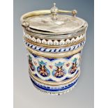 A Victorian ceramic biscuit barrel with plated lid
