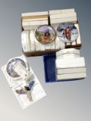 A box and crate containing assorted collector's plates and wall plaques,