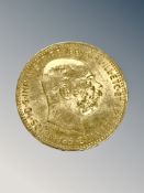 A 22ct gold 1915 20 Corona Austrian coin, 6.7g.