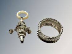 An antique silver whistle/rattle,