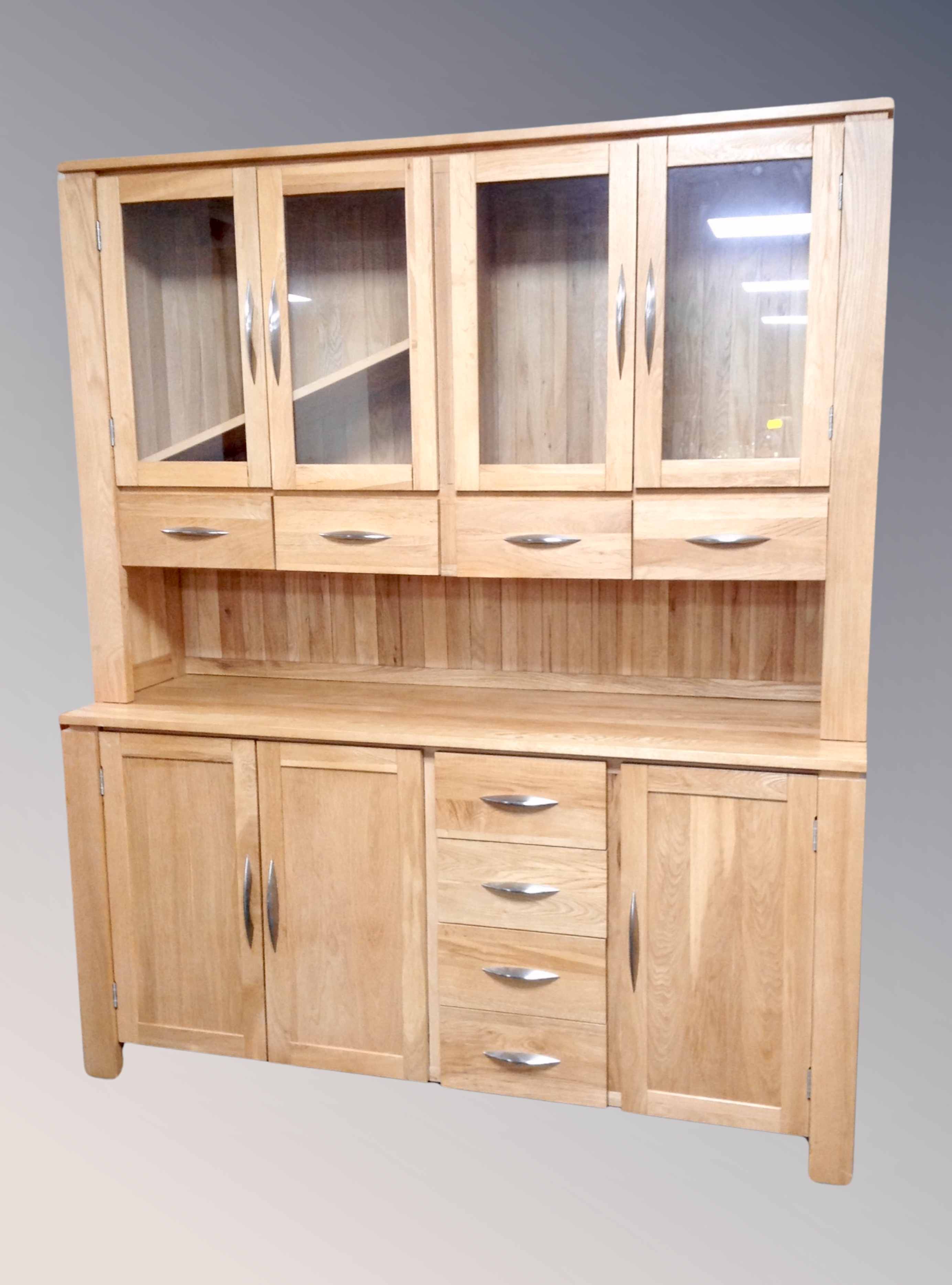 A contemporary oak four drawer dresser, height 190 cm width 160 cm depth 48.