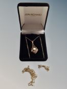 A 9ct gold pendant inset pearl on gold trace chain together with two further gold trace chains