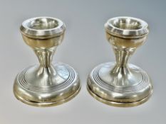 A pair of Birmingham silver short candlesticks, height 6.