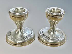 A pair of Birmingham silver short candlesticks, height 6.