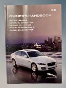 Ten Jaguar XE Driver's Manuals/Owner Booklets in Original Wallets.