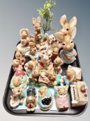 A collection of Pendelfin Rabbit ornaments with stand