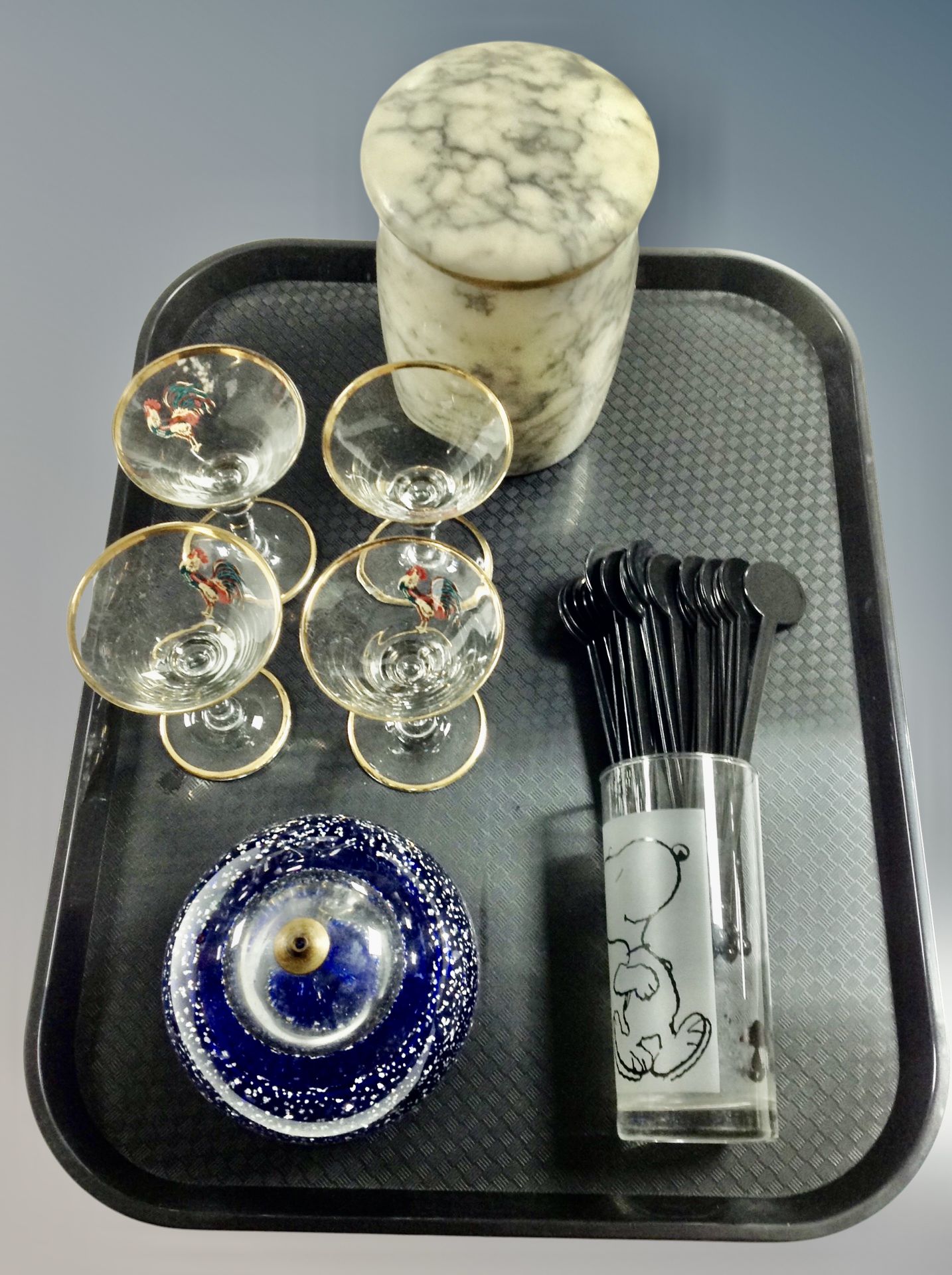 A blue studio glass oil light, four French cocktail or Martini glasses,