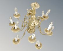 A brass twelve branch chandelier